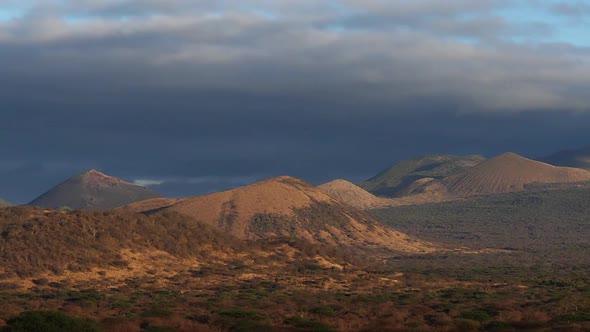 Savannah landscape in Tsavo Park, Mountain and forest, Kenya, Slow motion alt