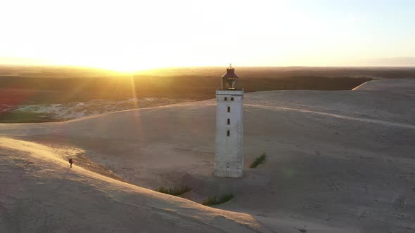 Drone Flight Over Rubjerg Knude Lighthouse At Sunset alt