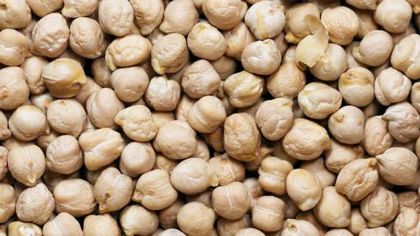 Close-up chickpeas, dry beans. chickpeas seeds abstract background. slider motion alt