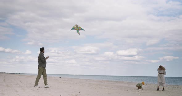 Happy family relax and having fun with kite in holiday vacation trip. Childhood, Dream Lifestyle. alt