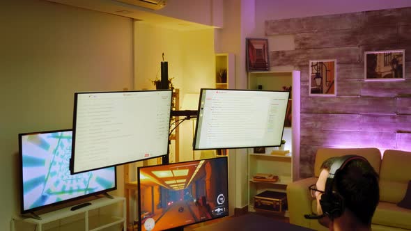 Bearded Pro Gamer with Headphones During a Shooter Championship alt