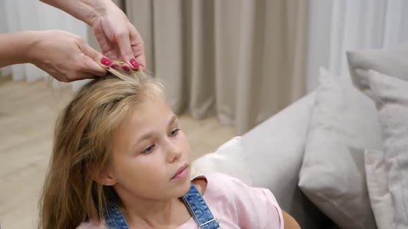 Cropped Hands Of Mother Braiding Daughter Hair Slow Motion
