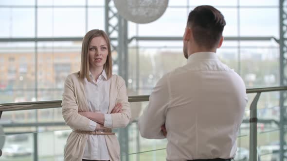 Beautiful Businesswoman Speaking With Colleague alt