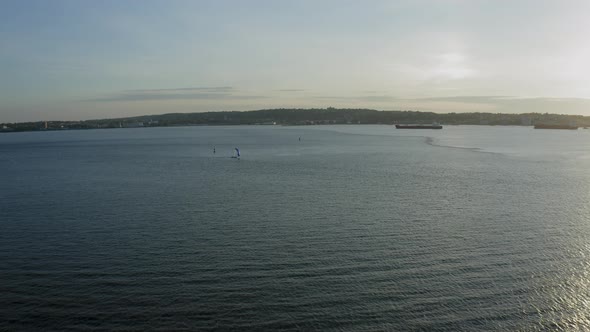 Aerial Tracking Shot of a Sailboat in New York Harbor (Bay Ridge, Brooklyn, New York)