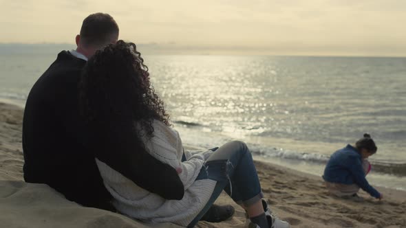 Lovely Family Enjoying Beach Sunset on Sea Vacation alt