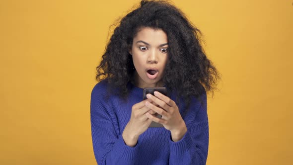 Portrait of Afro American Woman Holding Smartphone