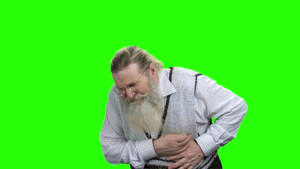 Senior Man Having Sudden Heart Attack alt