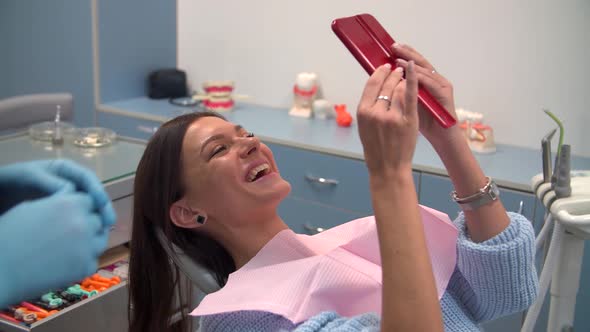 Woman at the Dentist After Hygiene Procedure