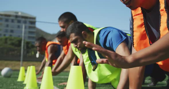 Soccer players training on field alt