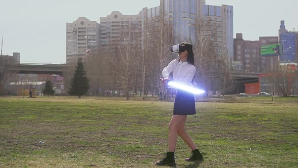 Female Warrior Practice Fencing with Laser Light Saber Swords in VR Goggles alt