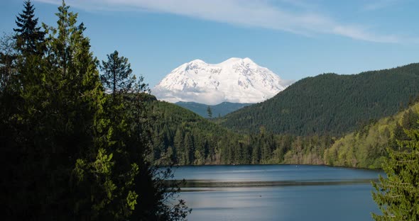 Mount Rainier Snowy Mountain Peak Above Lake Timelapse Pacific Northwest Washington State Sunny Day alt