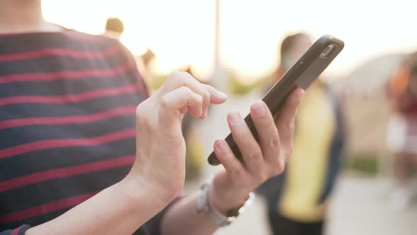 Woman using smartphone. Close up shot.