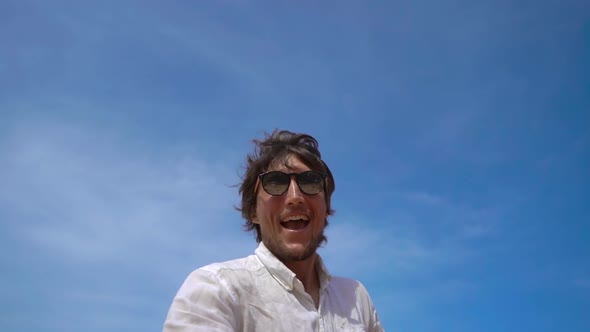 Superslowmotion Shot of a Happy Tourist Have Fun on a Tropical Beach with an Airplane Flying Over alt