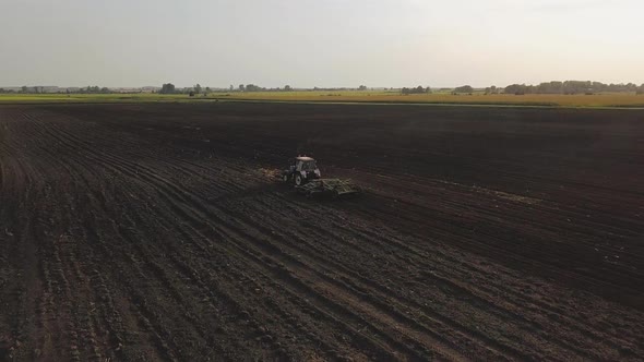 Aerial Drone Shot of a Farmer Spraying Soybean Fields alt