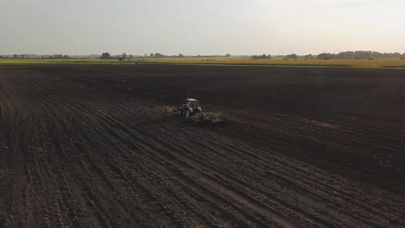 Aerial Drone Shot of a Farmer Spraying Soybean Fields