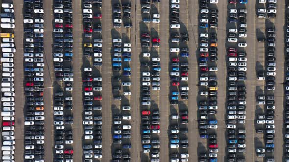 Aerial of a Automotive Car Terminal Parking Lot Storage Loading Area Ready for Distribution in the alt