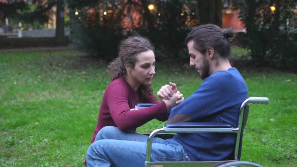 words of comfort - young woman tries to console his sad disabled boyfriend alt