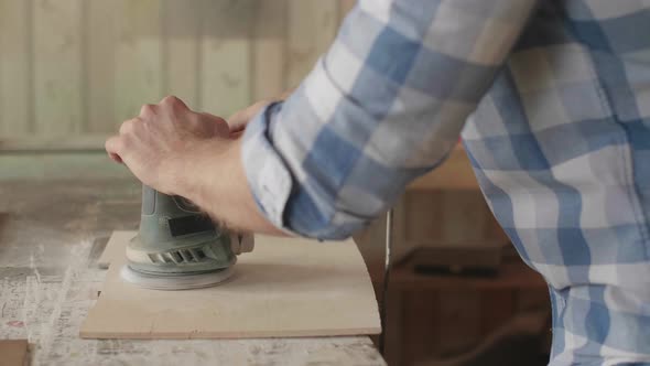 Carpenter Uses a Grinding Machine to Align