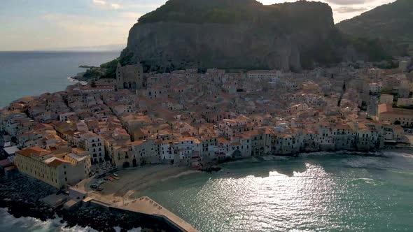 Cefalu Sicily Sunset at the Beach of Cefalu Sicilia Italy Mid Age Men and Woman on Vacation Sicily alt