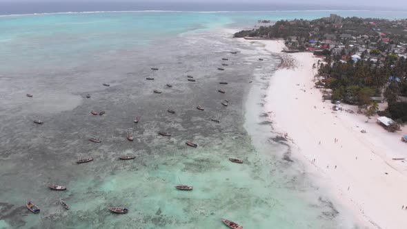 Lot Fishing Boats Stuck in Sand Off Coast at Low Tide Zanzibar Aerial View alt