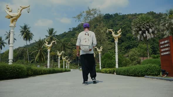 Man Walking Throw Beatiful Thailand Road