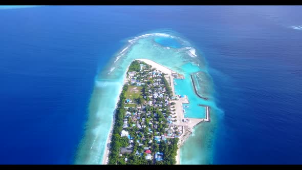 Aerial above abstract of relaxing tourist beach lifestyle by blue sea with bright sand background of alt