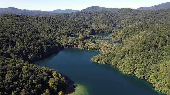 Flying over the famous Plitvice Lakes with forest at summer in Croatia, Europe alt