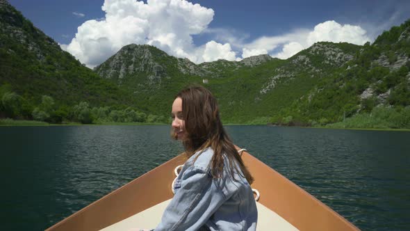 Couple Enjoying a Motor Boat Ride on the Lake