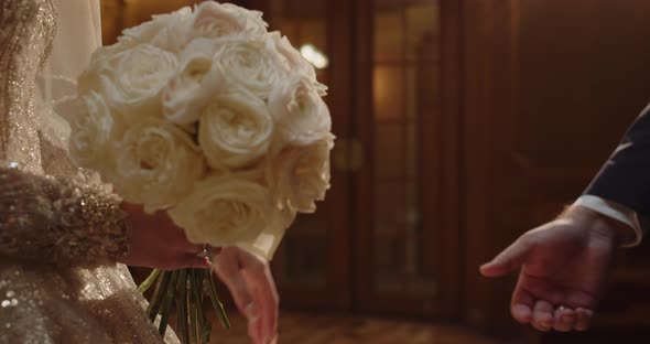 The Groom Extends His Hand To The Bride alt