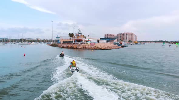 Tourists Riding Motorboats At Poniente Beach On Costa Blanca In Benidorm Spain alt