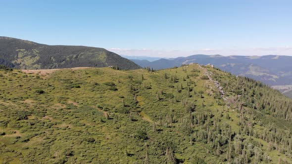 Aerial Panoramic View of Green Mountain Range and Hills in Valley of Carpathian alt