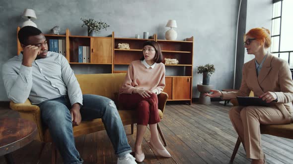 Diverse Family Couple Complaining about Relationships to Female Counselor alt