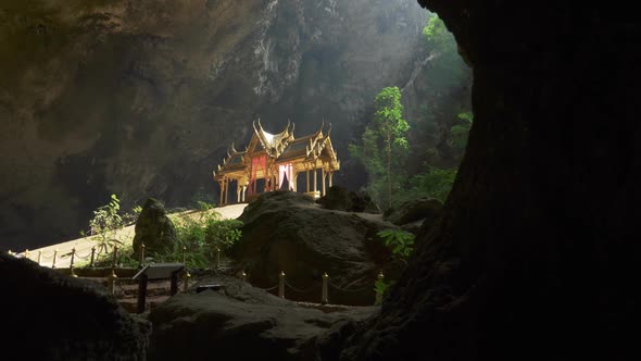 Phraya Nakhon Cave. Khao Sam Roi Yot National Park in Thailand. Sunbeam on Golden Buddhist Pavilion alt