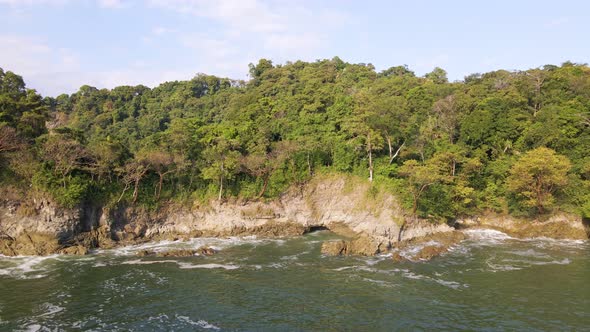 Untouched, tropical nature on a secluded peninsula on Costa Rica's west coast. Wide angle aerial pul alt