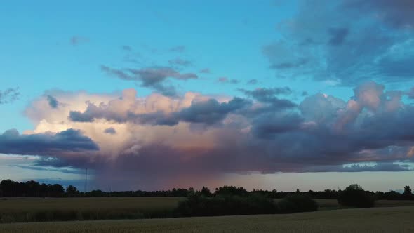 Crop Field After Rain and Storm Clouds in Background Rural Countryside. Aerial Dron Shot  alt