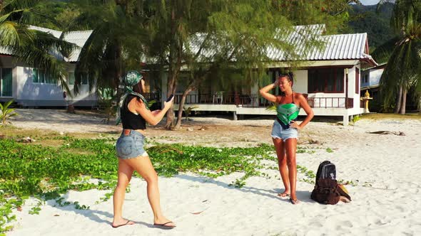 Ladies relaxing on beautiful shore beach lifestyle by blue lagoon with bright sand background of Tha alt
