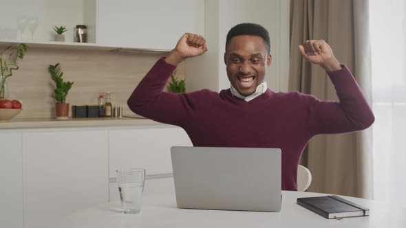 Africanamerican Guy Feel Excited Receiving Pleasant Email Message on Computer