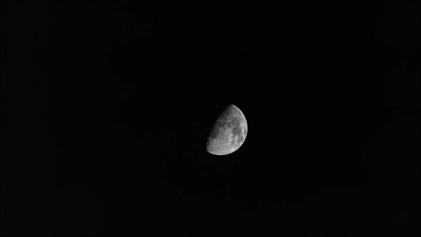Time lapse: the moon floating in night black sky