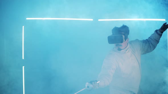 Male Fencer Is Having a Virtual Practice in Clouds of Smoke alt