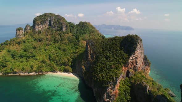 aerial drone panning right over Ko Kai (Chicken Head Island) surrounded by pristine white sand beach alt
