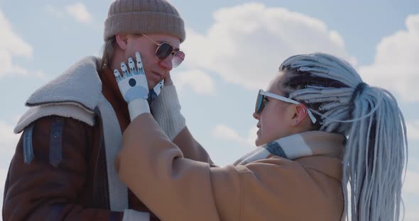 The woman with the bionic prosthesis is cuddling on a frozen Baikal lake Cybernetic Baikal alt
