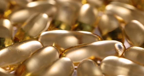 Transparent Capsules with Yellow Oil Liquid Slow Motion  Movie alt