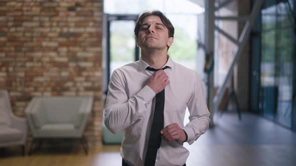Medium Shot Confident Satisfied Employee Posing in Office Corridor Indoors alt