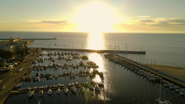 Bright Sunlight Reflection At The Calm Water Of Gdańsk Bay With Vessels Moored By The Baltic Coast I alt