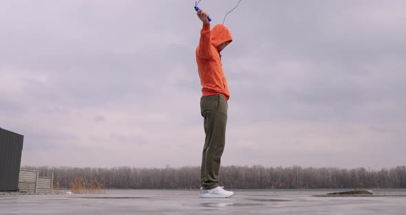 Young Man Skipping Rope Jumping Outdoor alt