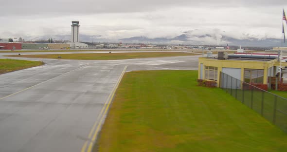 Helicopter aerial of brightly lit tower of Morongo Casino, night alt