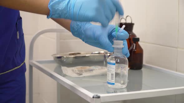 Doctor Prepares a Syringe alt