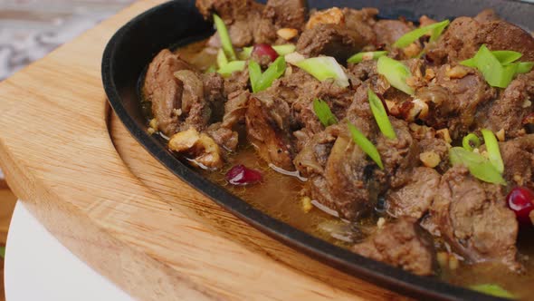 Beef Stew in Frying Pan on Table Close Up View
