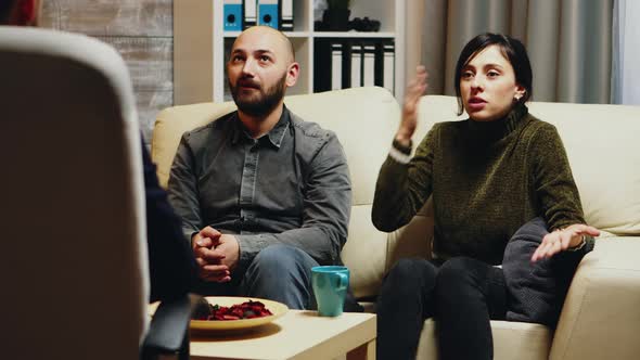 Young Wife Telling Psychoanalyst About Her Relationship Difficulties alt