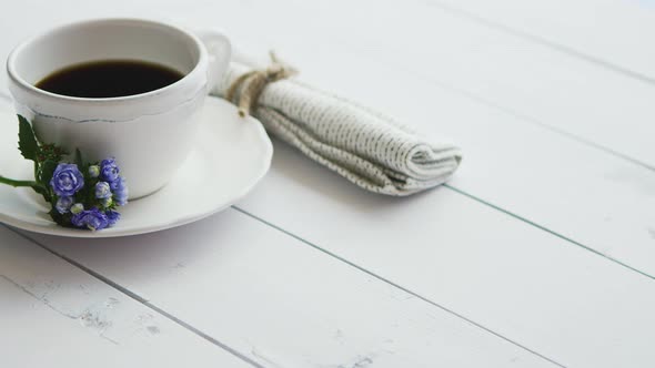 Black Coffee in White Cup on Bright Wooden Background. alt